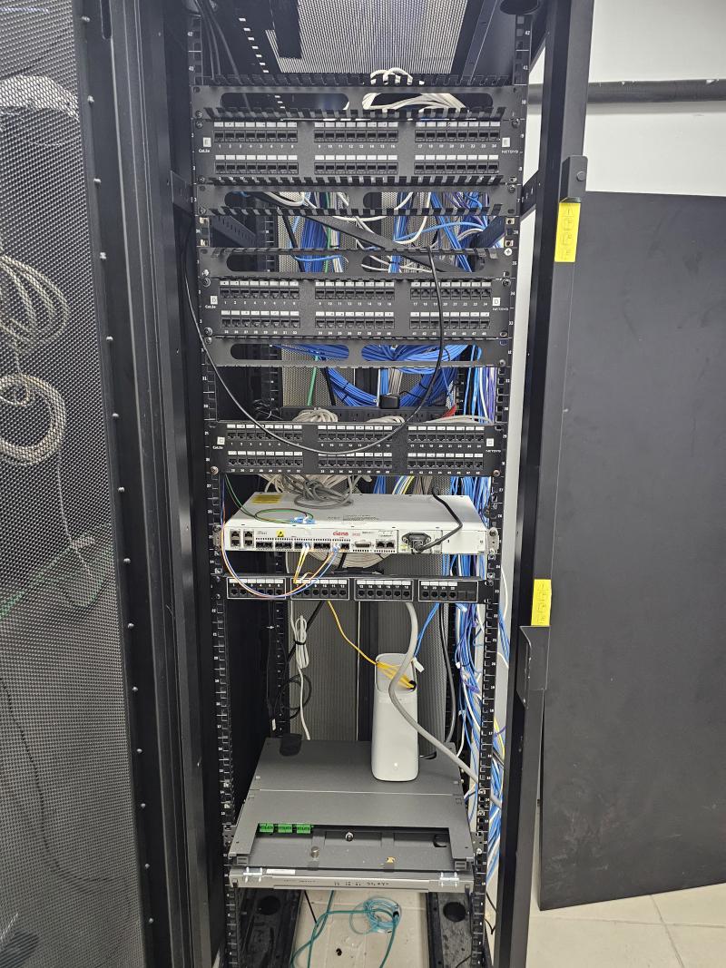 Network rack medium size company with CAT6 cables & power distribution.