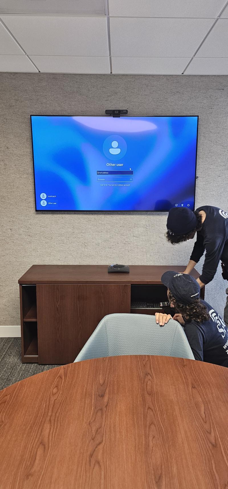 Conference room with dual displays and PTZ camera